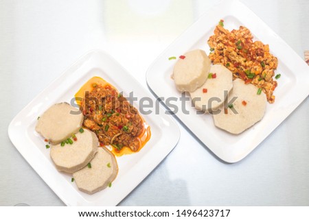 Cooked yam with fried egg sauce