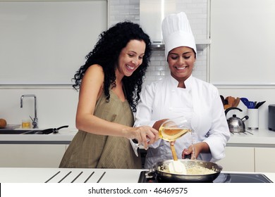 Cookery Course: Pouring Wine Into A Pan With Risotto