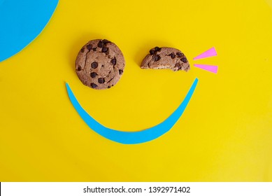 Cookie With Chocolate Chips.
Happy Smiley Face With Cookie Eyes