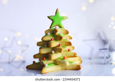 a cookie Christmas tree made by a star cookie cutter. christmas table decoration - Shutterstock ID 2194454371