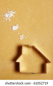 Cookie Cutter House On Dough With Flour Clouds