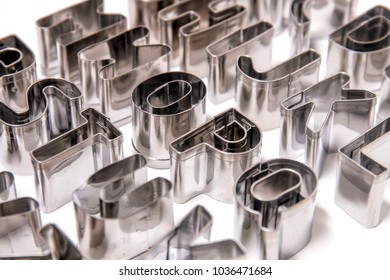 Cookie Cutter Letters Isolated On A White Background.