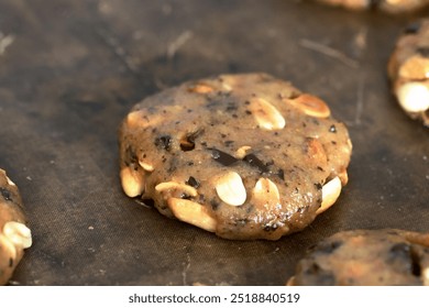 Cookie dough. With peanuts and chocolate. Close-up. - Powered by Shutterstock