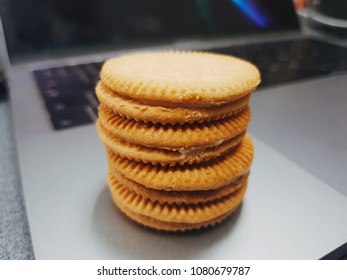 Cookie on a napkin on a work table.