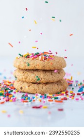 Cookie stack with sprinkles on a white background