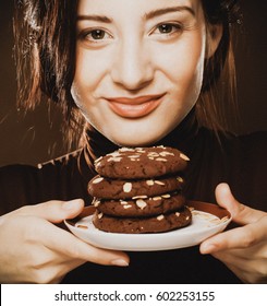 Cookie Woman Eating Chocolate Chip Cookies On Beige  Background.