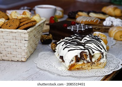 Cookies and cakes with coffee on a light table 