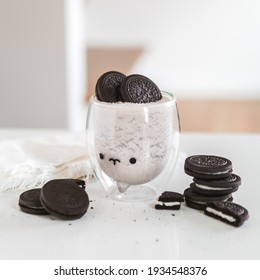 Cookies and cream shake in cute narwhal cup on kitchen counter