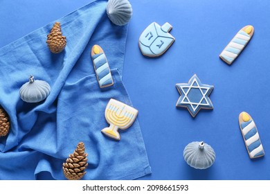 Cookies For Hanukkah Celebration And Christmas Decor On Color Background