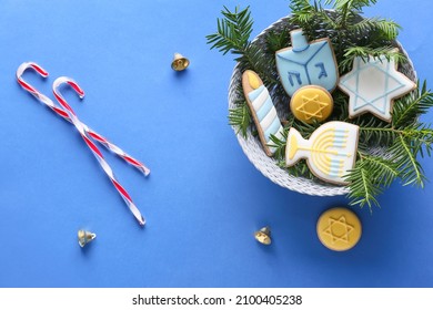 Cookies For Hanukkah Celebration And Christmas Decor On Color Background