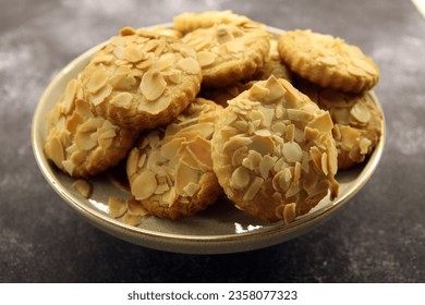 Cookies with nuts isolated on black background. - Shutterstock ID 2358077323