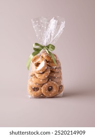 Cookies in a plastic bag with a butterfly ribbon, Cookie packaging. High quality photo