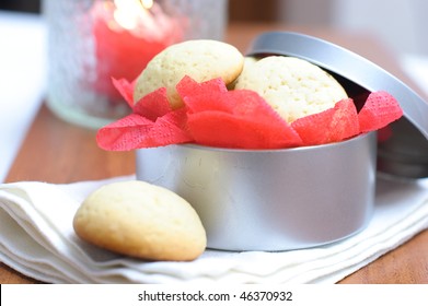 Cookies In A Round Box With A Red Paper Napkin