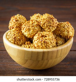 cookies with sesame seeds on a wooden table