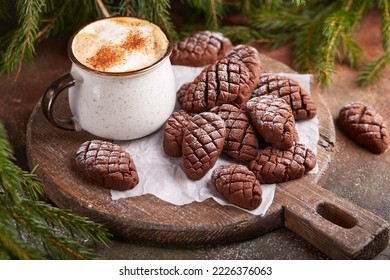 Cookies in a shape of Christmas tree cones with chocolate. Delicious New Year homemade dessert. - Powered by Shutterstock