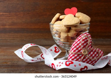 Cookies In The Shape Of A Heart In The Ice Cream Bowls On A Wooden Table Next To A Decorative Heart With Ribbon