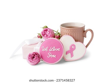 Cookies with text WE LOVE YOU, pink ribbon, rose flower, gift box and cup of tea isolated on white background. Breast cancer awareness concept - Powered by Shutterstock