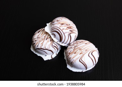 Cookies In White Glaze On A Wooden Table Lose Up