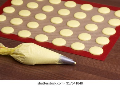 Cooking Bag And A Silicone Mat With Macaroon On Blurred Background