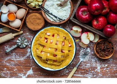 Cooking baking concept. Making rustic American style apple pie, top view on table with ingredients