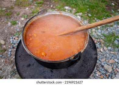 Cooking Bean Goulash In A Caldron On Open Flame