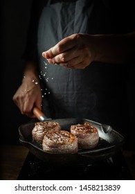 Cooking Beef Steak On Grill Pan By Chef Hands On Black Background For Copy Space Text Restaurant Menu,