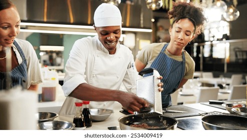 Cooking, class and chef in kitchen with women for meal preparation, teaching gourmet recipe and learning skills. Culinary course, students or mentor with lesson on food education or cuisine knowledge - Powered by Shutterstock