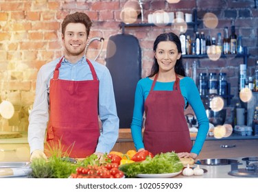 Cooking Class, Culinary, Food And People Concept - Happy Couple In Kitchen