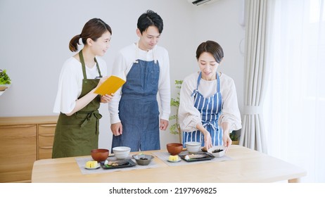 Cooking class instructor and students - Powered by Shutterstock