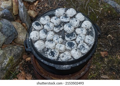 Cooking With Coals Atop The Pot Lid Of The Dutch Oven.