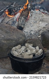 Cooking With Coals Atop The Pot Lid Of The Dutch Oven.