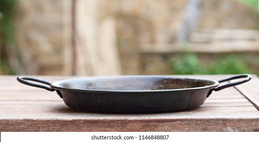 Cooking composition of the old cooking Frying pan over the wooden table
