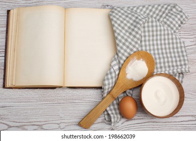 Cooking concept. Ingredients and kitchen tools with the old blank recipe book - Shutterstock ID 198662039