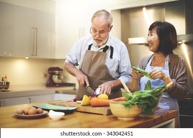 Cooking Couples Elders Kitchen Food Happiness Family Fresh Meal Home Concept - Powered by Shutterstock