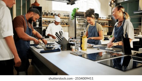 Cooking, course and chef learning students in kitchen for knowledge, cutting technique and teaching. Culinary class, people and mentor with lesson on onion preparation and education in hospitality - Powered by Shutterstock