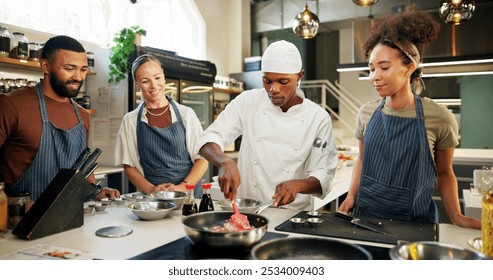 Cooking course, chef and meat in kitchen with preparation, teaching gourmet meal recipe or learning. Culinary class, people or mentor with lesson on food education or cuisine knowledge in hospitality - Powered by Shutterstock