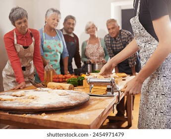 Cooking course, pasta and chef with senior people in kitchen for help, guide or how to questions, advice or steps. Learning, class and nutritionist with audience for teaching, ravioli or nutrition - Powered by Shutterstock