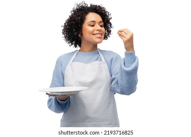 cooking, culinary and people concept - happy smiling woman in apron holding empty plate showing gourmet sign over white background - Powered by Shutterstock