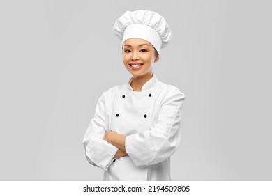 cooking, culinary and people concept - happy smiling female chef in white jacket over grey background - Powered by Shutterstock