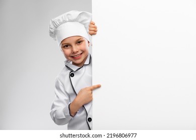 Cooking, Culinary And Profession Concept - Happy Smiling Little Boy In Chef's Toque And Jacket With White Board Over Grey Background