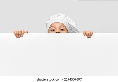 Cooking, Culinary And Profession Concept - Little Girl In Chef's Toque And Jacket With White Board Over Grey Background