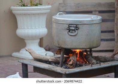 Cooking dinner outside in winter using firewood in UAE
