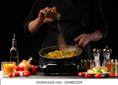 Cooking dishes with meat and vegetables. Oriental cuisine, Asia food. Seasoning, freezing in motion. Vegetables and meat, tasty and wholesome food. - Shutterstock ID 1654812229