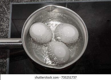 Cooking Eggs In Boiling Water In Pan Top View
