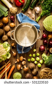 Cooking - Empty Pot With Autumn (fall) Vegetables Around. Vintage Rustic Wood As Background. Rural Kitchen Table - Flat Lay Composition (from Above, Top View). 