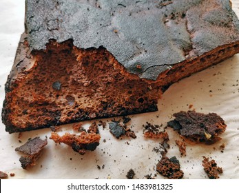 Cooking Failure, Burnt Pie With Black Crust On Baking Paper