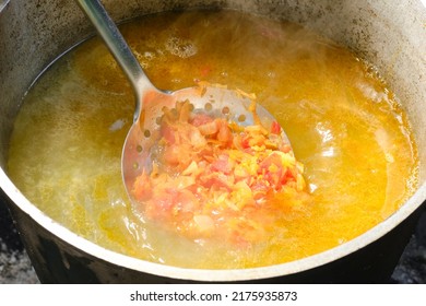 Cooking Fish Soup Or Uha On A Fire. Delicious Fish Broth With Vegetables. Shallow Depth Of Field.