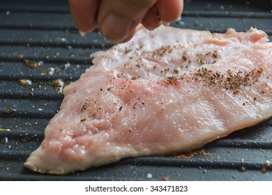 cooking fish Steak on frying pan - Shutterstock ID 343471823