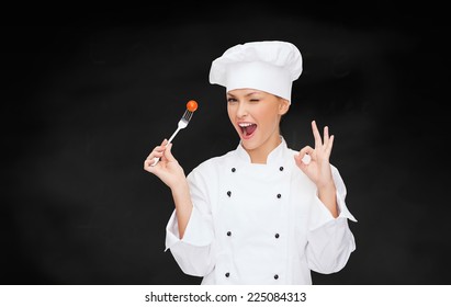 Cooking And Food Concept - Smiling Female Chef, Cook Or Baker With Fork And Tomato Showing Ok Sign