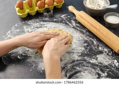 cooking food and culinary concept - close up of hands making shortcrust pastry dough on table - Shutterstock ID 1786462556